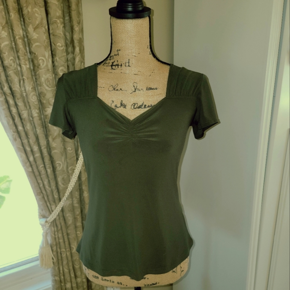Olive colored cap sleeve v neck knit top with rushing.
